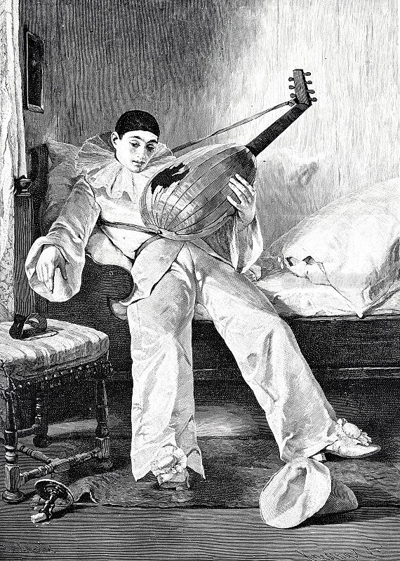 悲伤的小丑在圣灰星期三,上床睡觉,把他的曼陀林放在一边