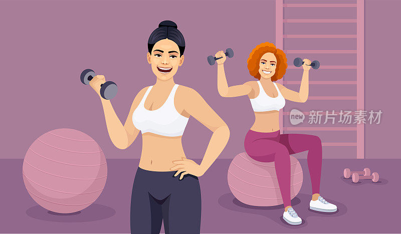 两个漂亮的健身女在健身房。