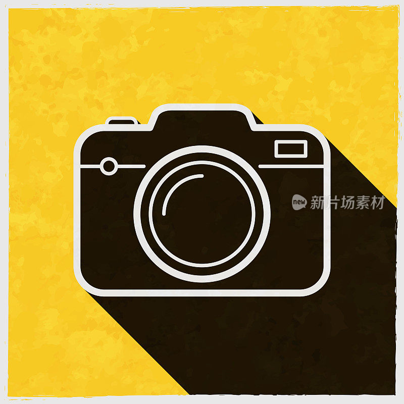 相机。图标与长阴影的纹理黄色背景