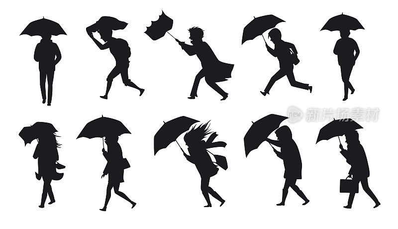 人们在风雨中撑着伞行走