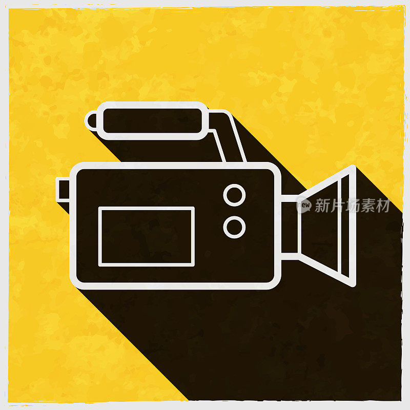 摄像机。图标与长阴影的纹理黄色背景