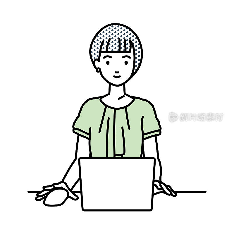 一个随意工作的女人在她的办公桌上使用笔记本电脑
