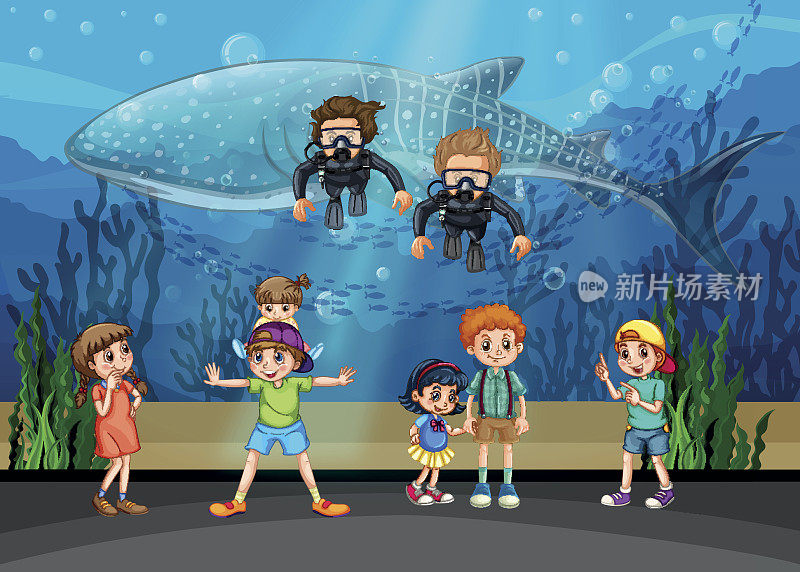 孩子们在水族馆里看鲸鱼和潜水员