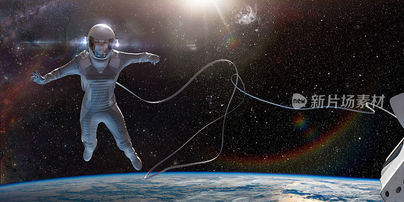 女宇航员在太空行走时用缆绳连接到宇宙飞船