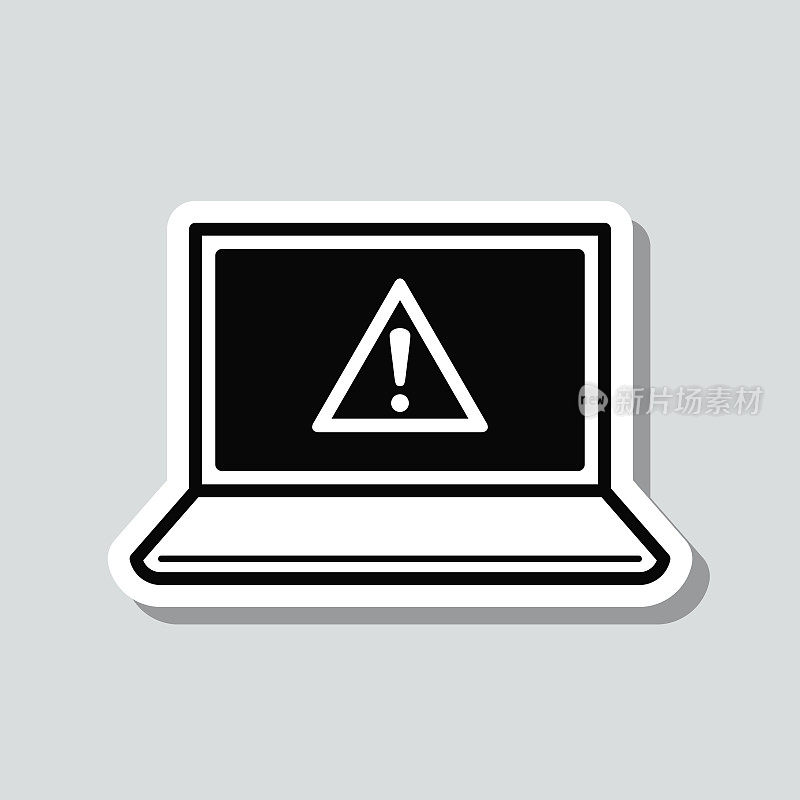 笔记本电脑，注意危险警告。图标贴纸在灰色背景