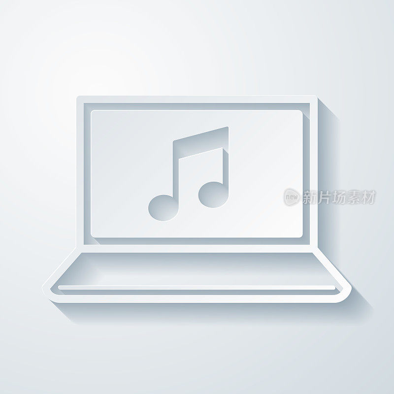 笔记本电脑上播放音乐。空白背景上剪纸效果的图标