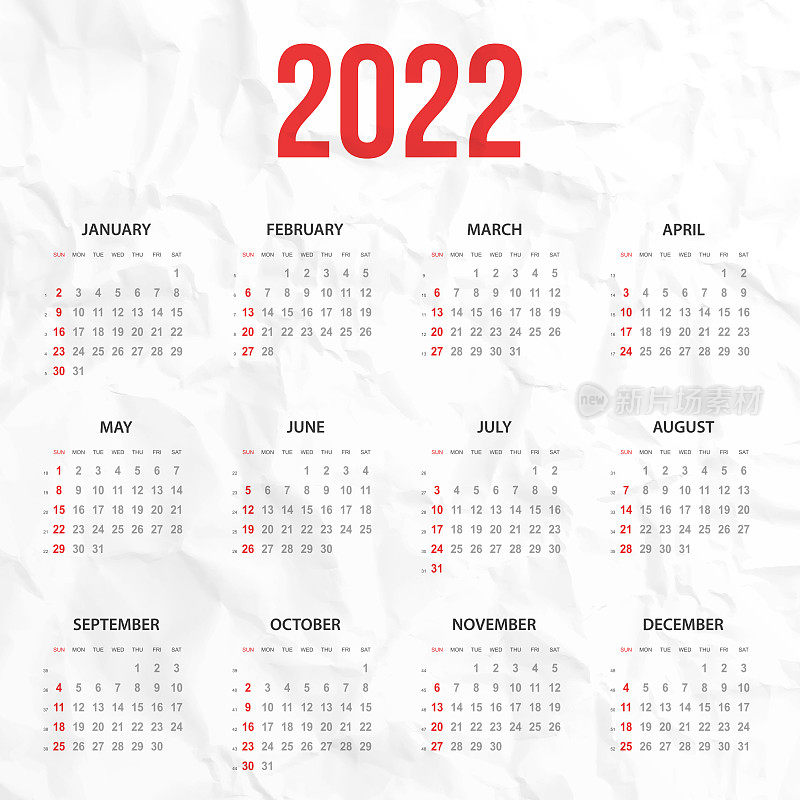 白色皱巴巴的背景上的2022年日历