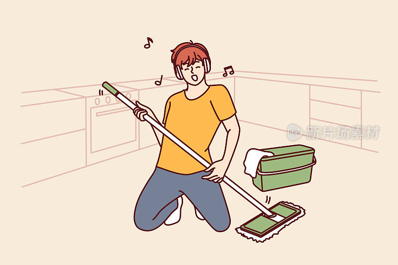 用拖把打扫地板的人站在摇滚音乐家的姿势，想象着他拿着吉他