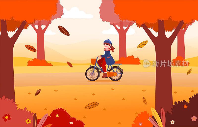一个年轻女子在秋天的公园里骑自行车