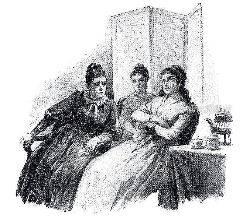 三个女人坐在客厅的咖啡桌上聊天