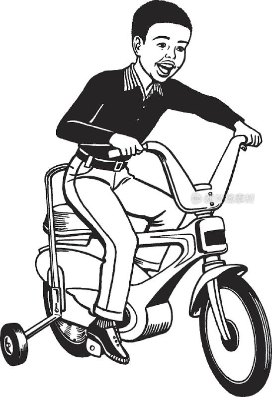 男孩骑着带辅助轮的自行车