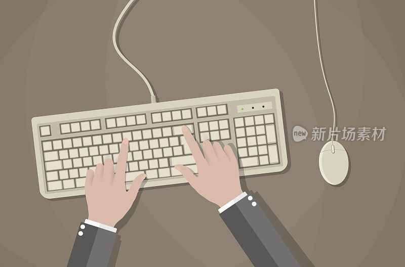 用户用手操作电脑的键盘和鼠标。