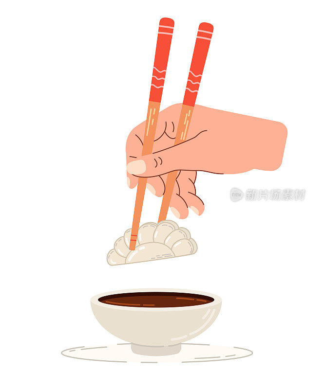 用酱油蘸一下日式饺子。中国筷子在手。