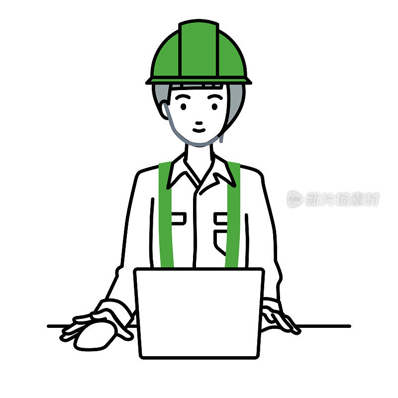 一个在建筑工地工作的女人在她的办公桌上使用笔记本电脑