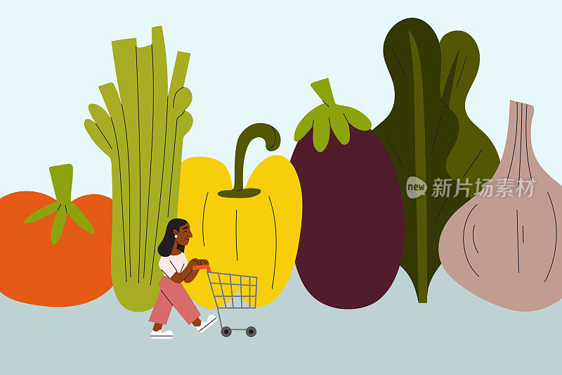 一位年轻女子推着购物车买蔬菜