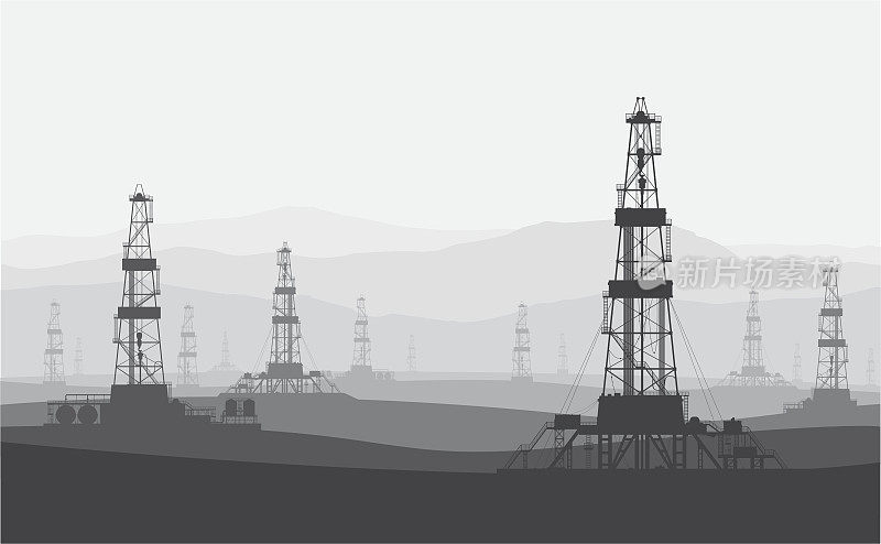 山脉上大型油田的石油钻机。