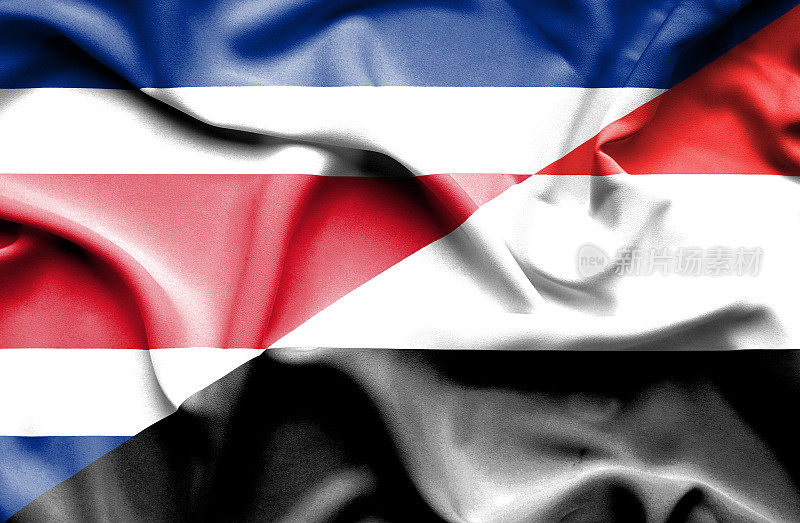 挥舞着也门和哥斯达黎加的旗帜