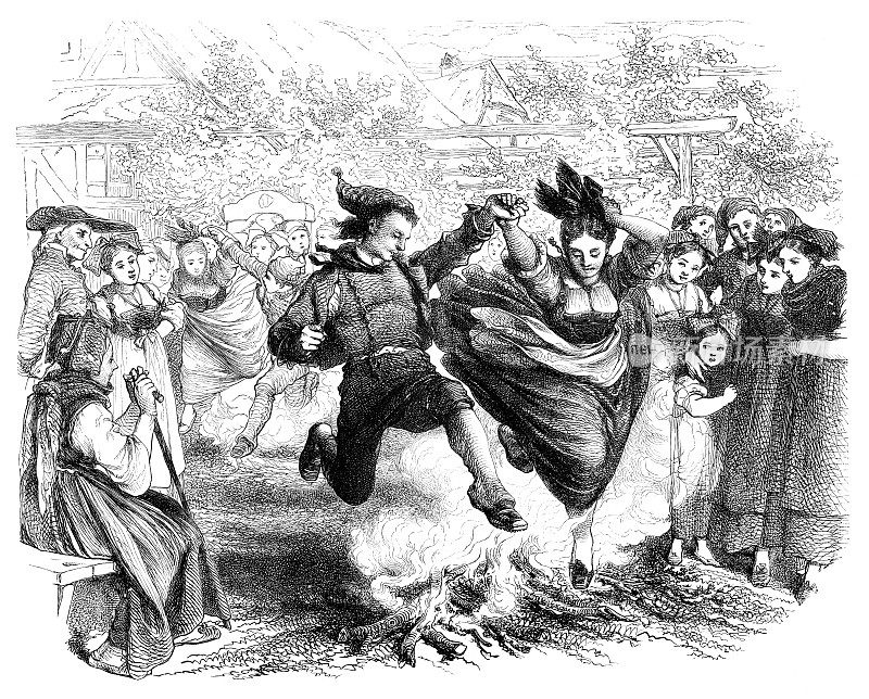 1864年在法国村庄的圣・让节上，一对夫妇跳过火