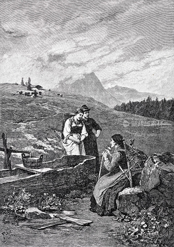 妇女们在山井里取水