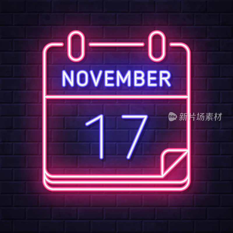 11月17日。在砖墙背景上发光的霓虹灯图标