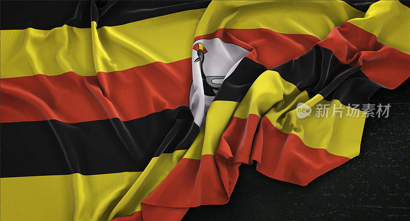 乌干达旗帜皱在黑暗的背景3D渲染