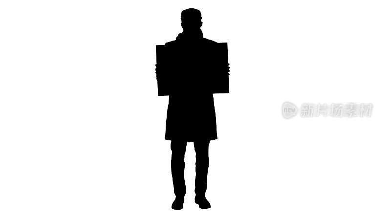 剪影男子在一个时髦的服装和医疗面具拿着空白的公告牌