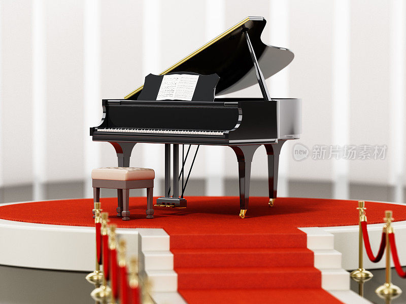 红地毯和天鹅绒绳索通向舞台上的音乐会钢琴