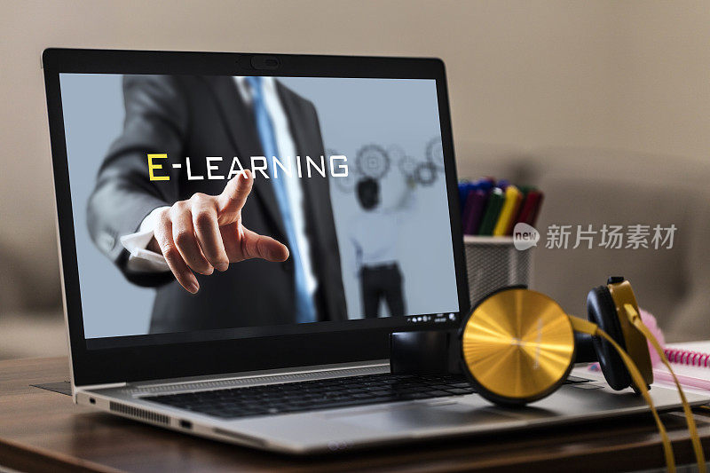 带笔记本电脑和耳机的在线教育E-Learning概念