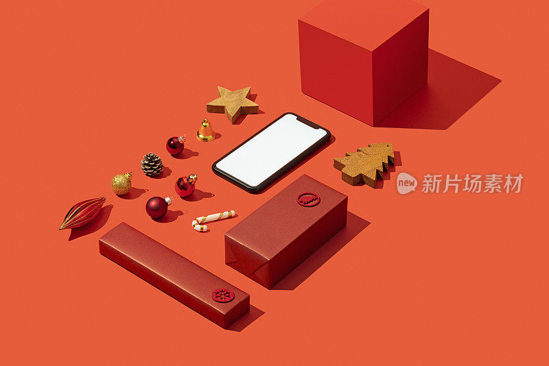 智能手机模型，模板上的圣诞概念红色背景与圣诞装饰