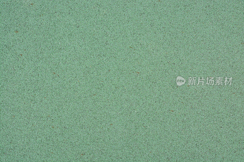 纹理绿色操场橡胶地板作为背景。（