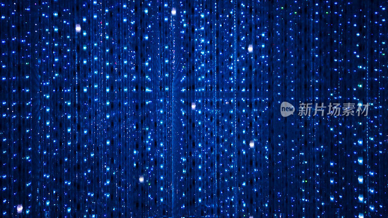 蓝色舞台背景的LED闪烁和闪烁的灯泡。