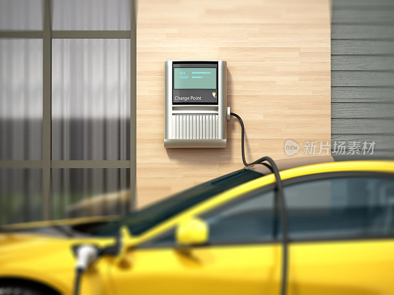 运动电动汽车正在充电与现代充电器使用
壁挂式充电装置。可持续和环境友好的能源概念。