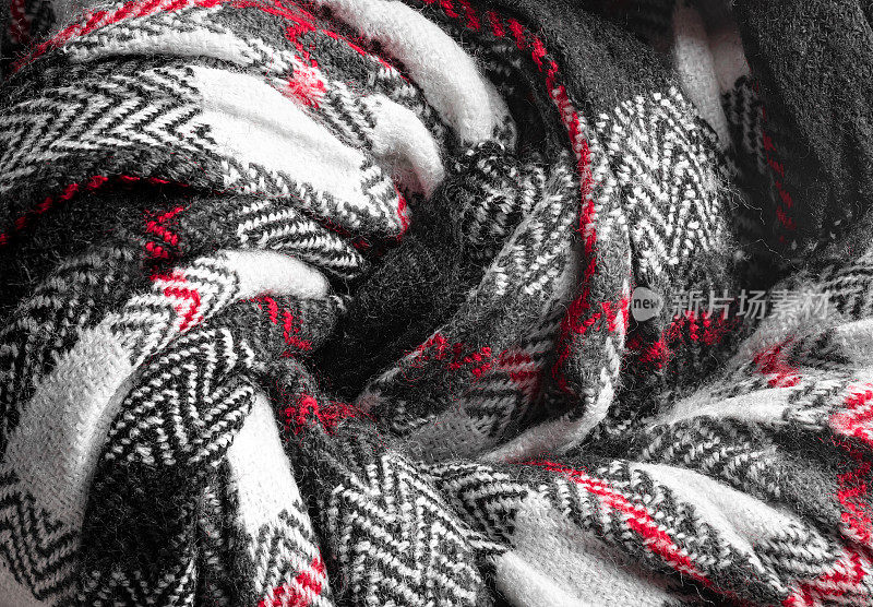 针织纹理天然柔软的羊毛针织面料，黑白红色为底色