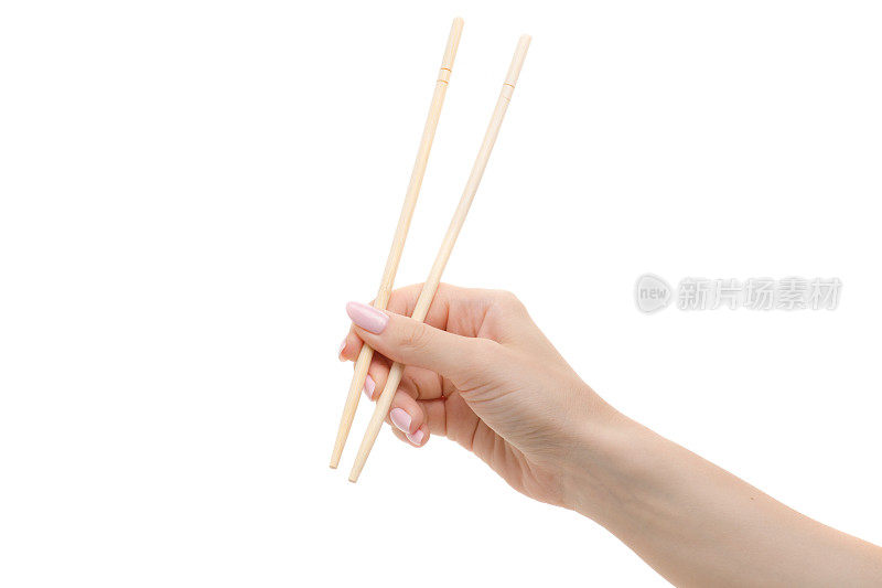 女人手里拿着的寿司筷子