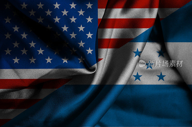 挥舞着洪都拉斯和美国的旗帜