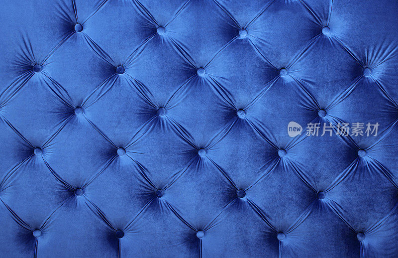 蓝色天鹅绒capitone纺织背景，复古切斯特菲尔德风格