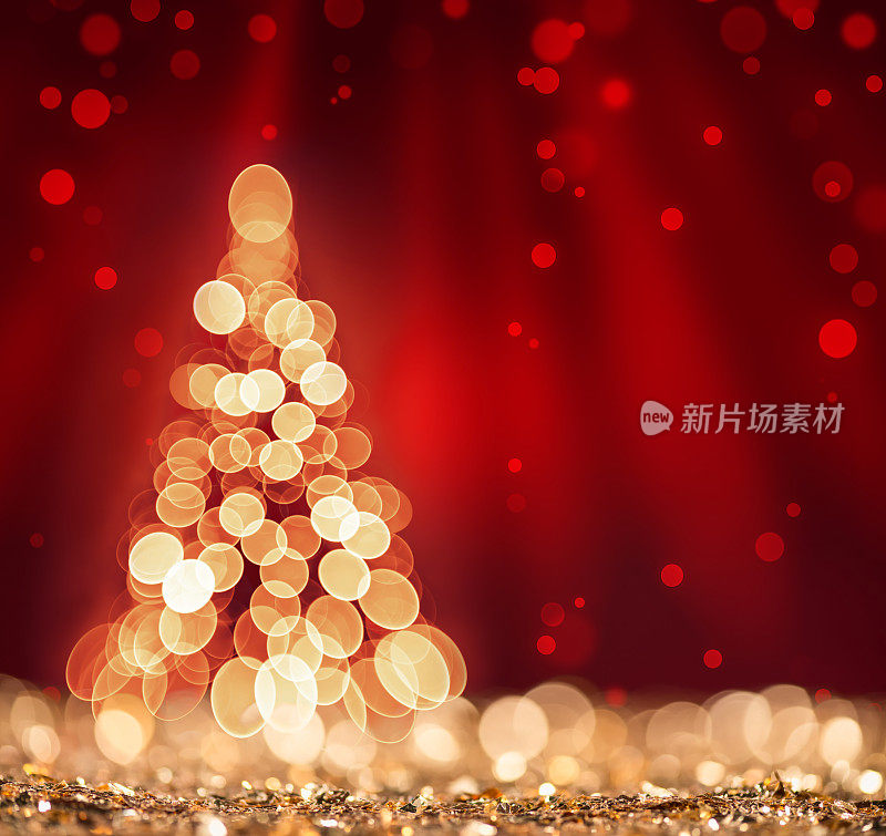 红色灯光和圣诞树散焦sparkles背景