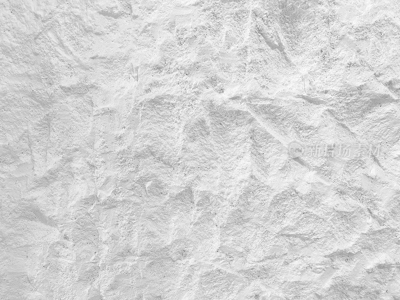 白墙表面的白色石材纹理粗糙，色调偏灰。使用这个壁纸或背景图像岩石背景。有一个空白的地方用来放文字。