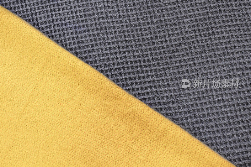 照亮黄色和灰色纺织品，2021年的颜色，俯视图，抽象图案