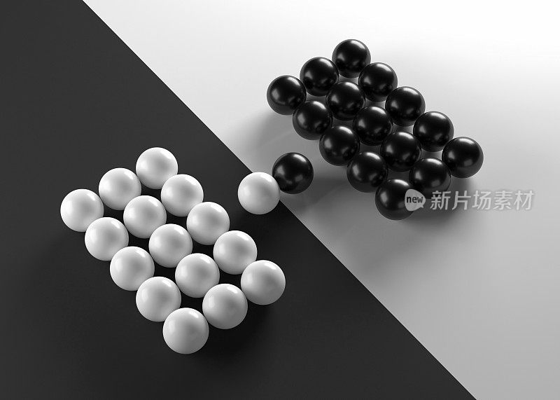 一组黑色和白色的球面对着对方
