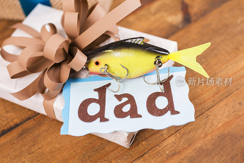 父亲节钓鱼送给爸爸的礼物。诱惑,解决。弓。