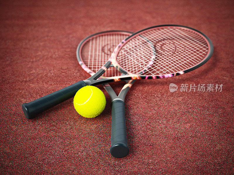 网球拍和球放在粘土表面上
