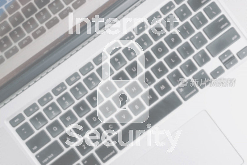 黑客安全数据保护。模糊键盘背景上的计算机Internet安全符号。商业、技术、互联网和网络安全理念。
