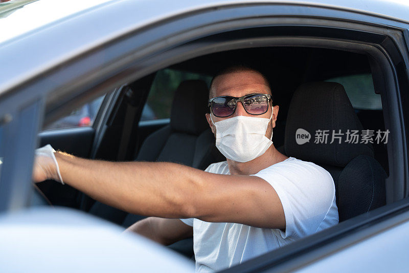 戴着医用防护口罩的司机肖像。在大流行疾病。