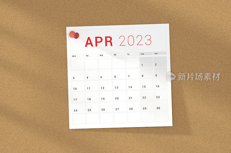 2023年4月日历页钉在软木板。