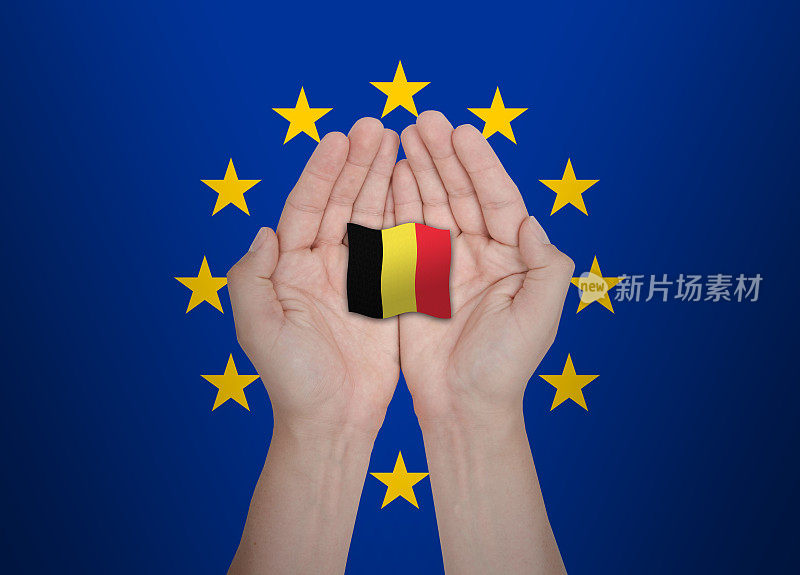 欧盟手保护欧盟成员国比利时的旗帜