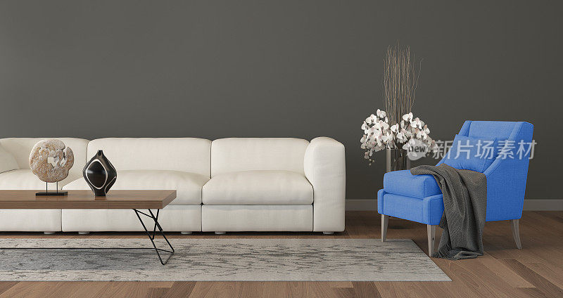 客厅里的现代蓝色扶手椅和沙发