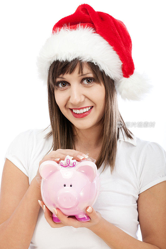 戴着圣诞帽，拿着存钱罐的年轻女子