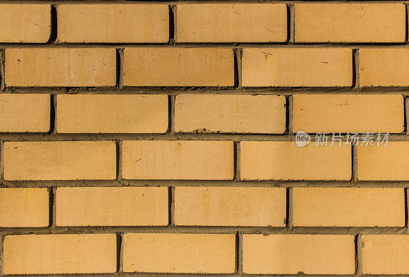 黄色硅酸盐砖墙特写。