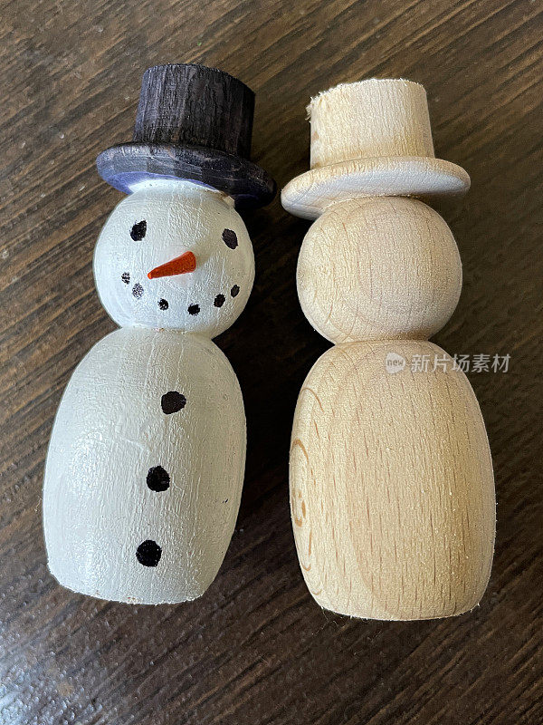 特写图像不完整的木制雪人节日自制圣诞装饰在桌子上，手工装饰